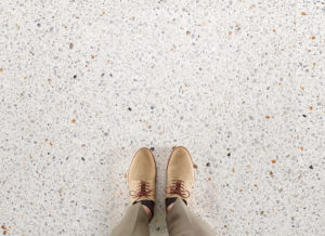 room with large terrazzo look porcelain tile